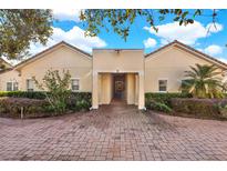 Attractive multi-Gathering home with paver driveway and lush landscaping at 995 David Walker Dr, Tavares, FL 32778