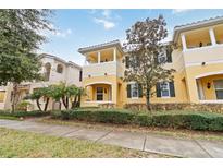 Two story townhome with front porch and landscaping at 12096 Talitha Ln, Orlando, FL 32827