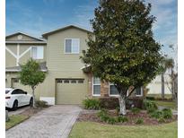 Charming two-story home with attached garage and landscaped front yard at 1939 Chatham Place Dr, Orlando, FL 32824