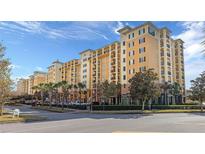 Resort-style building exterior, multiple stories, featuring upscale finishes and a prime location at 8112 Poinciana Blvd # 1709, Orlando, FL 32821