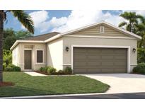 Charming single-story home with a two-car garage and landscaped front yard at 4148 Lavender Ct, Lake Hamilton, FL 33851