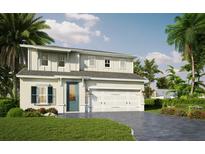 Charming two-story home with a paved driveway, green lawn, and tropical landscaping at 100 Elena Lavin Cir # 39, Orlando, FL 32807