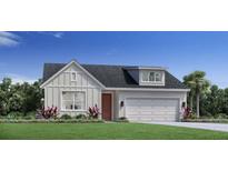 One-story home with a two-car garage and front landscaping at 1409 Stoneway Pl, Apopka, FL 32703