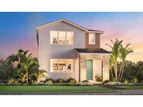 Two-story contemporary home with light-colored exterior and landscaping at 1693 Crowncrest Dr, Apopka, FL 32703
