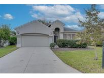 Single-story home with a two-car garage and well-manicured lawn at 1175 Chessington Cir, Lake Mary, FL 32746