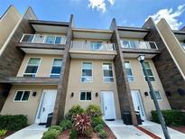 Modern townhome community with three-story buildings and private entrances at 3185 Brasilia Ave, Kissimmee, FL 34747