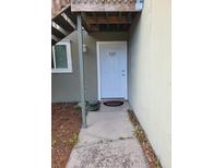 Light blue front door entrance to condo unit with walkway at 327 Scottsdale Sq # 327, Winter Park, FL 32792