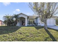 Single-story home with a large yard and screened garage at 839 Franconville Ct, Kissimmee, FL 34759