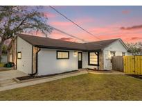 Updated house exterior boasts a fresh coat of paint and landscaping at 2762 Hilda Cv, Winter Park, FL 32792