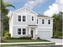 Two-story house with gray siding, stone accents, and a two-car garage at 339 Conway Ave, Saint Cloud, FL 34771