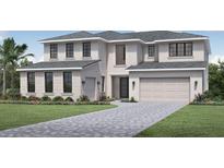 Two-story home with light-colored siding, a three-car garage, and a nicely landscaped front yard at 9620 English Laurel E Ct, Orlando, FL 32827