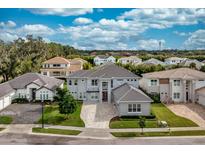Luxury home community, featuring a stunning two-story house with a stone facade and tile roof at 2205 Lake Sylvan Oaks Ct, Sanford, FL 32771