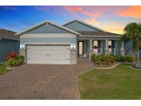 Beautiful two-story home with a two-car garage and landscaped yard at 3288 Sailing Pier Ave, Winter Garden, FL 34787