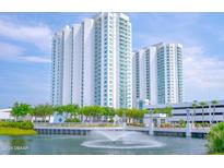 Luxury highrise building with water features and landscaping at 231 Riverside Drive # 509-1, Holly Hill, FL 32117