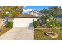 Attractive single-story home with a two-car garage and landscaped yard at 813 Sterling Spring Rd, Orlando, FL 32828