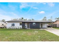 Updated single story home with modern exterior and landscaping at 4856 Victory Dr, Orlando, FL 32808