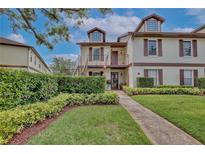 Two-story condo with landscaped walkway and manicured lawn at 600 Northern Way # 1608, Winter Springs, FL 32708