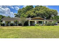 Charming ranch home with mature landscaping and a spacious yard at 245 Lake Seminary Cir, Maitland, FL 32751