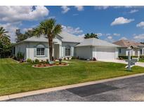 One-story home with landscaped yard and two car garage at 2291 Nw 59Th Ter, Ocala, FL 34482