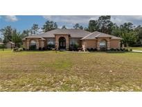 Spacious one-story home with landscaped yard at 10411 Sw 52Nd Ct, Ocala, FL 34476