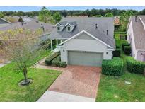 Two-story house with brick driveway and attached garage at 3554 Nw 55Th Cir, Ocala, FL 34482
