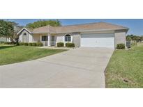 One-story home with attached garage and landscaping at 2093 Nw 50Th Cir, Ocala, FL 34482