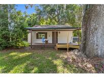Cozy cottage with covered porch and ramp at 11531 Se 60Th Ave, Belleview, FL 34420