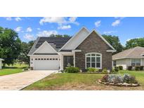 Charming craftsman style home with stone accents and solar panels at 728 Lake Diamond Ave, Ocala, FL 34472