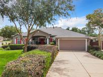 House exterior with driveway and landscaping at 10969 Sw 45Th Ave, Ocala, FL 34476