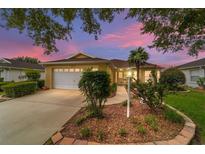 House exterior at dusk showcasing landscaping and driveway at 9372 Sw 90Th St, Ocala, FL 34481