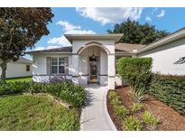 Inviting home exterior with landscaped walkway at 9500 Sw 93Rd Loop, Ocala, FL 34481