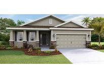 Attractive one-story home with landscaping and two-car garage at 3144 Canopy Oak Blvd, Wildwood, FL 34785