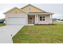 Charming one-story home with a welcoming front porch and landscaped yard at 4720 Se 25Th Loop, Ocala, FL 34480