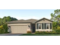 One-story home with two-car garage and landscaped yard at 9345 Sw 60Th Court Rd, Ocala, FL 34476