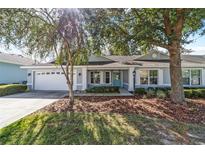 Charming one-story house with teal door at 9287 Sw 91St Court Rd, Ocala, FL 34481