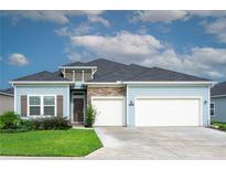 Newly built home with two-car garage and stone accents at 7531 Sw 77Th Ave, Ocala, FL 34481