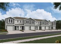 New townhome community with attached garages and landscaping at 6603 Sw 81St Loop, Ocala, FL 34476