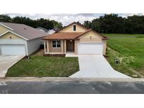 Newly constructed one-story home with a two-car garage at 4776 Se 25Th Loop, Ocala, FL 34480