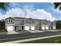 Row of townhouses with attached garages at 6595 Sw 81St Loop, Ocala, FL 34476