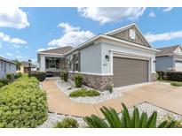 Modern house exterior with a two-car garage at 9911 Sw 100Th Terrace Rd, Ocala, FL 34481