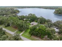 Lakefront home nestled among lush trees at 11196 Ne 227Th Place Rd, Fort Mc Coy, FL 32134