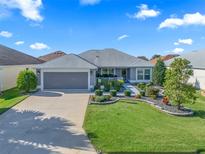Beautiful home with well-manicured landscaping at 3812 Nottingham Loop, The Villages, FL 32163