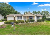 Charming one-story home with landscaped yard at 8947 Sw 115Th St, Ocala, FL 34481