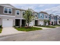 Row of townhouses with attached garages at 3468 Se 37 Ct, Ocala, FL 34480