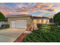 Charming one-story home with a two-car garage and well-manicured landscaping at 9053 Sw 103Rd Ave, Ocala, FL 34481