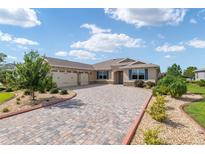 Beautiful two-car garage home with a paver driveway at 8445 Sw 93Rd Cir, Ocala, FL 34481