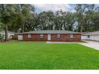 Brick ranch home with a large front yard at 5456 Nw 64Th St, Ocala, FL 34482