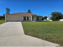 One-story house with attached garage and well-maintained lawn at 14984 Sw 28Th Terrace Rd, Ocala, FL 34473