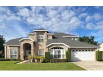 Two-story house with a large yard at 3403 Gatlin Place Cir, Orlando, FL 32812