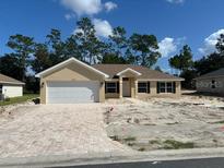 Newly constructed single-Gathering home with two-car garage at 6925 Sw 179Th Court Rd, Dunnellon, FL 34432